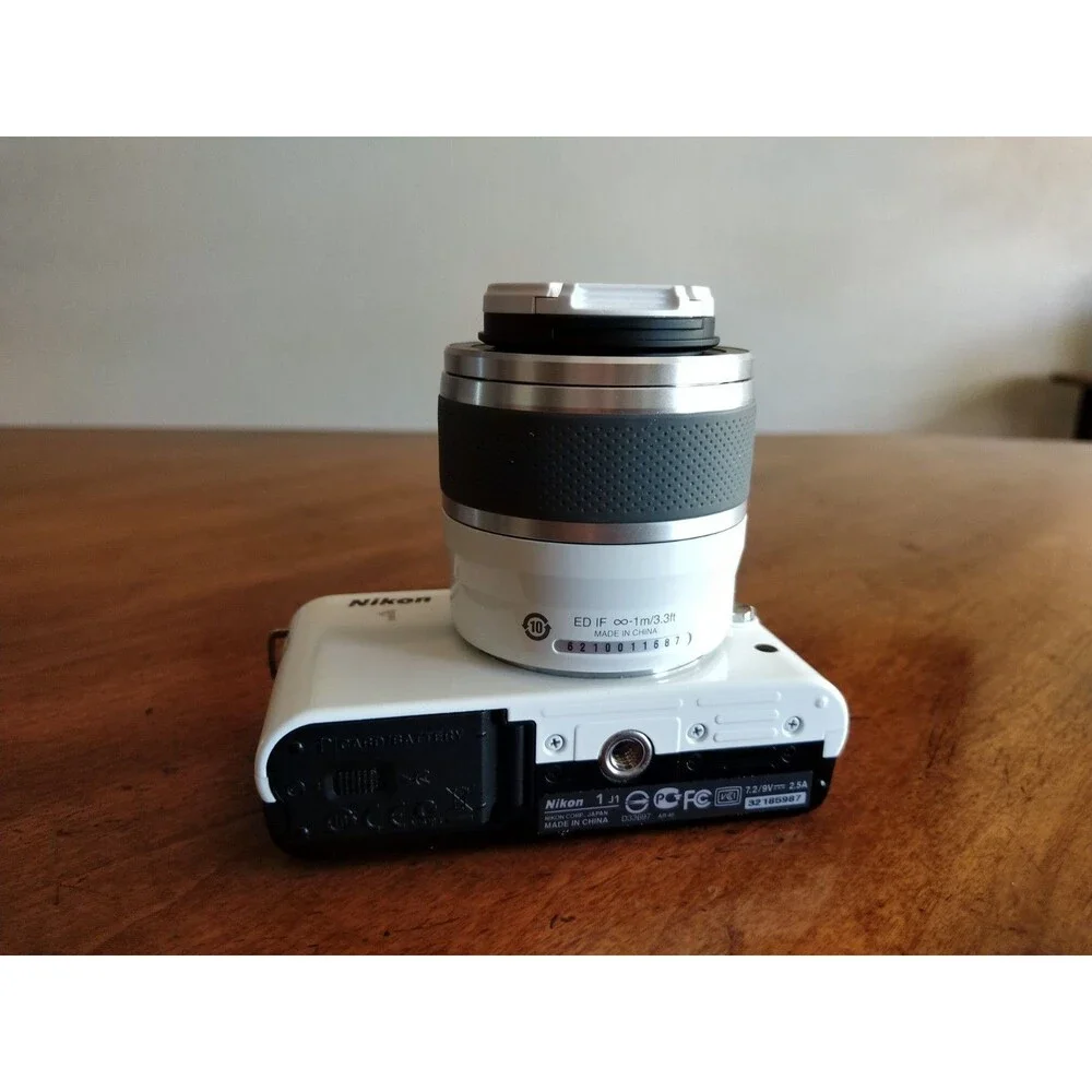 READ* Nikon 1 J1 White Digital Camera with 1 NIKKOR 10-30mm VR Lens
